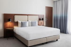 Katil atau katil-katil dalam bilik di Courtyard by Marriott Basel