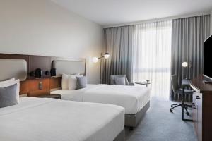 Katil atau katil-katil dalam bilik di Courtyard by Marriott Basel