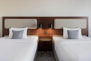 Katil atau katil-katil dalam bilik di Courtyard by Marriott Basel