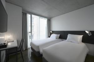 Tempat tidur dalam kamar di Creto Hotel Myeongdong