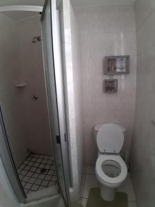 a small bathroom with a toilet and a shower at Mont Blanc 29 in Margate