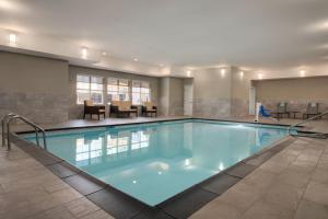 a large swimming pool in a hotel room at Residence Inn by Marriott Tulsa South in Tulsa