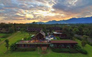 an aerial view of a house in a field at Puripai Villa in Pai