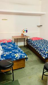 Voodi või voodid majutusasutuse JSR Boys Hostel - Malviya Nagar toas