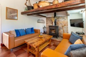a living room with two couches and a coffee table at New! Villa Na Ribes in Sant Carles de Peralta