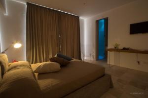 Calaporto-Holiday Home & Relaxにあるベッド