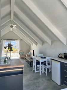 a kitchen and dining room with a white table and chairs at A Mountain & Country Haven in Stanford +13 photos