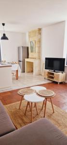 TV a/nebo společenská místnost v ubytování La Maisonnette en Medoc