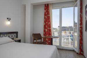 Postel nebo postele na pokoji v ubytování Hotel La Ruta