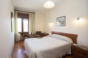 Postel nebo postele na pokoji v ubytování Hotel La Ruta