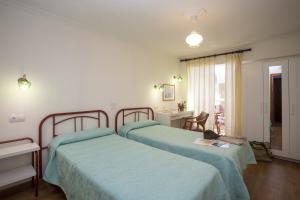Postel nebo postele na pokoji v ubytování Hotel La Ruta