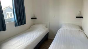 Ein Bett oder Betten in einem Zimmer der Unterkunft Waterpark Giethoorn