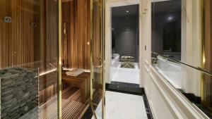 a bathroom with a tub and a shower with a toilet at Grand Hotel Principe Di Piemonte in Viareggio