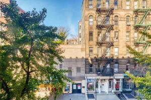 a large brick building on a city street at West Village 2br w in-unit wd nr shops NYC-1256 in New York