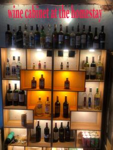 a display of bottles of wine in a wine cellar at Minh Quang homestay in Ba Be