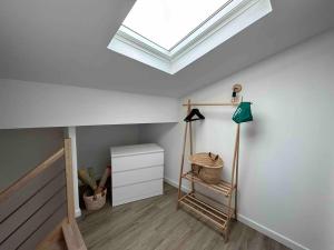 a skylight in a room with a white ceiling at Duplex au cœur du village de Cassis in Cassis