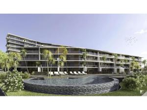 a large building with a fountain in front of it at Vista Mar - AC, Parking and pool in Funchal