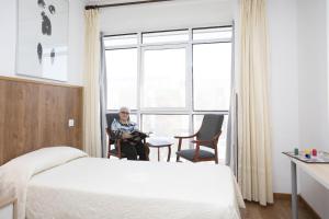 Postel nebo postele na pokoji v ubytování Hotel La Ruta