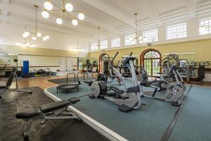 a gym with several treadmills and exercise bikes at Peaceful Putney apartment by UnderTheDoormat in London