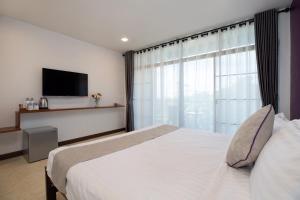 Postel nebo postele na pokoji v ubytování Aspira Resort Klong Muang Krabi