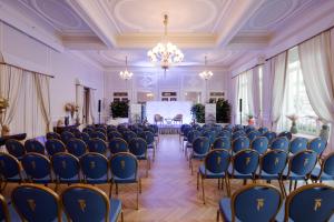 a room with chairs and a stage in the middle at Grand Hotel Principe Di Piemonte in Viareggio +37 photos