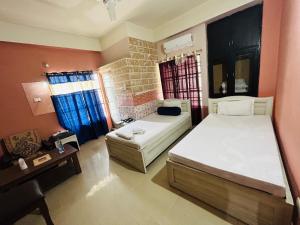 Hotel Siddarth Palace客房内的一张或多张床位