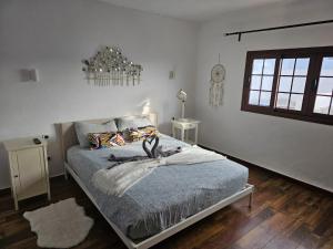 蒂納霍的住宿－Casa Vitto，卧室配有一张床