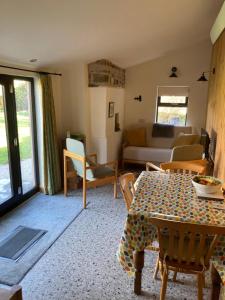 a living room with a table and a couch at The Rowe House in Horton in Ribblesdale