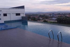 a swimming pool on top of a building at MyStudio Imperio Home , Alor Setar with sky infinity pool in Alor Setar