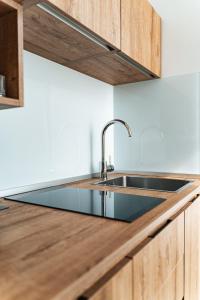 a kitchen with a sink and a counter top at Le Vie Del Centro Luxury Room in Matera