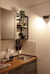 a kitchen with a sink and a counter top at Luxury me in Rome