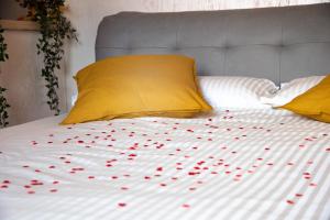 a bunch of red hearts on a bed at Luxury me in Rome