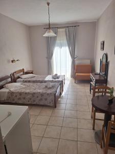 Postel nebo postele na pokoji v ubytování Miaritis rooms