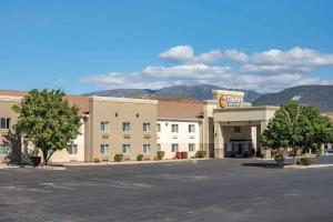 a hotel with a parking lot in front of it at Comfort Inn & Suites Beaver - Interstate 15 North in Beaver