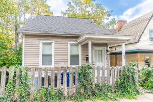 a house with a wooden fence in front of it at 1 BR - Parking - Amazing View Nearby! in Pittsburgh