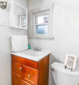 a bathroom with a sink and a toilet at 1 BR - Parking - Amazing View Nearby! in Pittsburgh