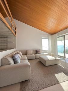 a living room with a couch and a table at Villa Montagna in Torri del Benaco +64 photos