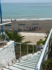 a group of people on a beach with the ocean at Mavi Cennet Camping&Pansiyon in Kızılot