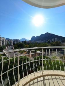 a view from the balcony of a building with mountains in the background at begonvil evleri in Antalya