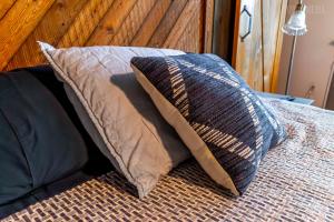 a pillow sitting on top of a bed at Studio Apt - Easy Access to City and Amazing View in Pittsburgh +33 photos