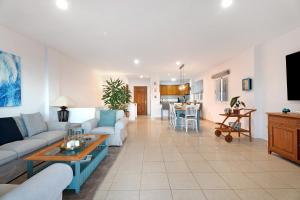 a living room with a couch and a table at Great Sunset Views Los Gigantes in Acantilado de los Gigantes