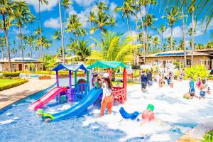 a group of children playing in a playground at Grand Oca Maragogi All Inclusive Resort in Maragogi
