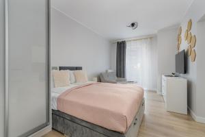 Posteľ alebo postele v izbe v ubytovaní Stylish & Comfy Garbary Apartments with Parking by Noclegi Renters