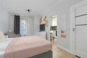 Posteľ alebo postele v izbe v ubytovaní Stylish & Comfy Garbary Apartments with Parking by Noclegi Renters