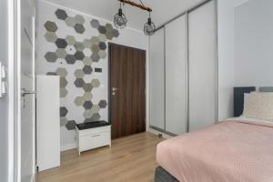 Posteľ alebo postele v izbe v ubytovaní Stylish & Comfy Garbary Apartments with Parking by Noclegi Renters