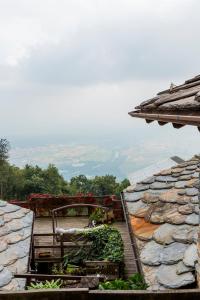 a view from the roof of a house with a stone wall at Chalet Palù in Brosso
