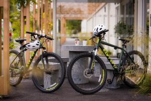 three bikes parked next to a table with helmets on them at The Club at Goffs 