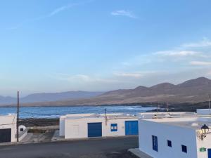 a view of a body of water and buildings at Casa Calandrilla in Caleta de Caballo