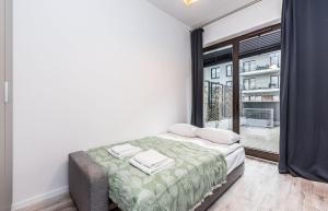 Posteľ alebo postele v izbe v ubytovaní Rent like home - Walońska 15