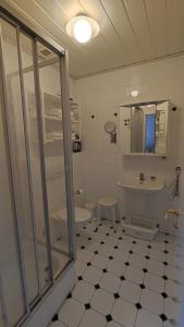 a bathroom with a tub and a toilet and a sink at Ferienhof Fenzl in Pocking